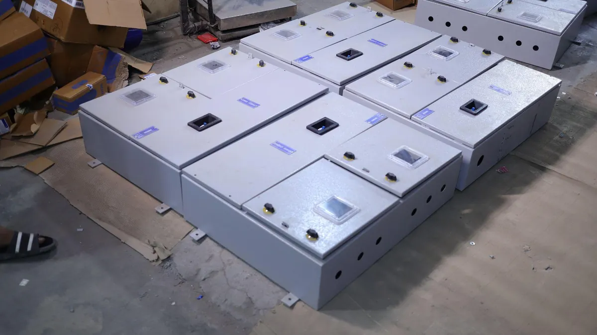 Wall-mounted meter board panels with meter viewing windows, ready for dispatch
